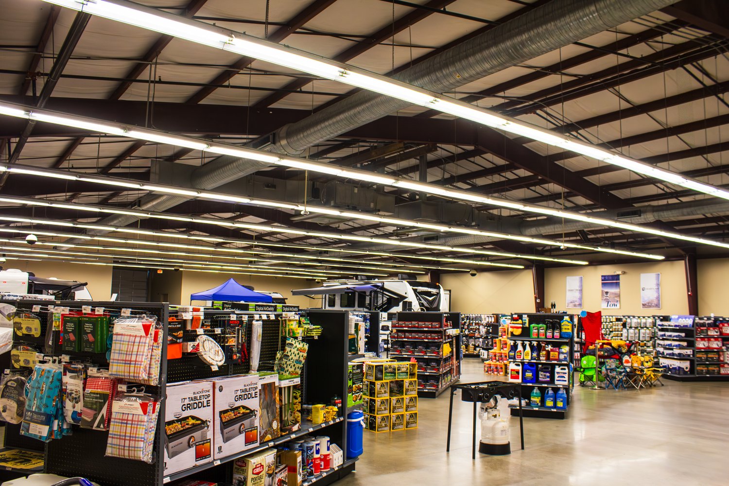 Great American RV Camping Store aisles stocked with griddles, camping gear, and RV accessories